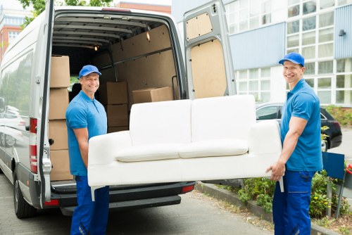 Family packing boxes for a home move with Kingston Self Storage
