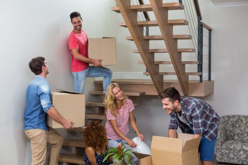 Professional team packing office equipment for relocation