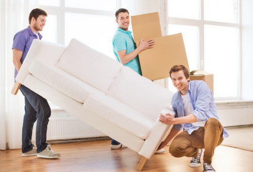 Professional movers packing items for storage